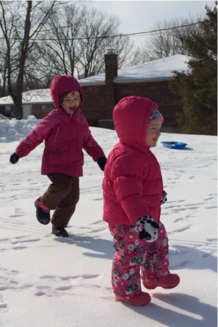 While Gwen took a long nap this morning, Josie enjoyed her first time frolicking in the snow with her big sister.