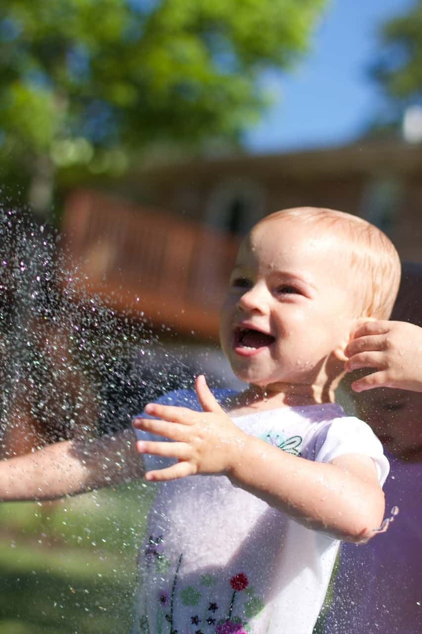 The girls, especially Gwen, had so much fun playing in the hose today. Gwen loved being sprayed in the face – just like her big sister at this age. I think we might have at least two future swimmers amongst us!