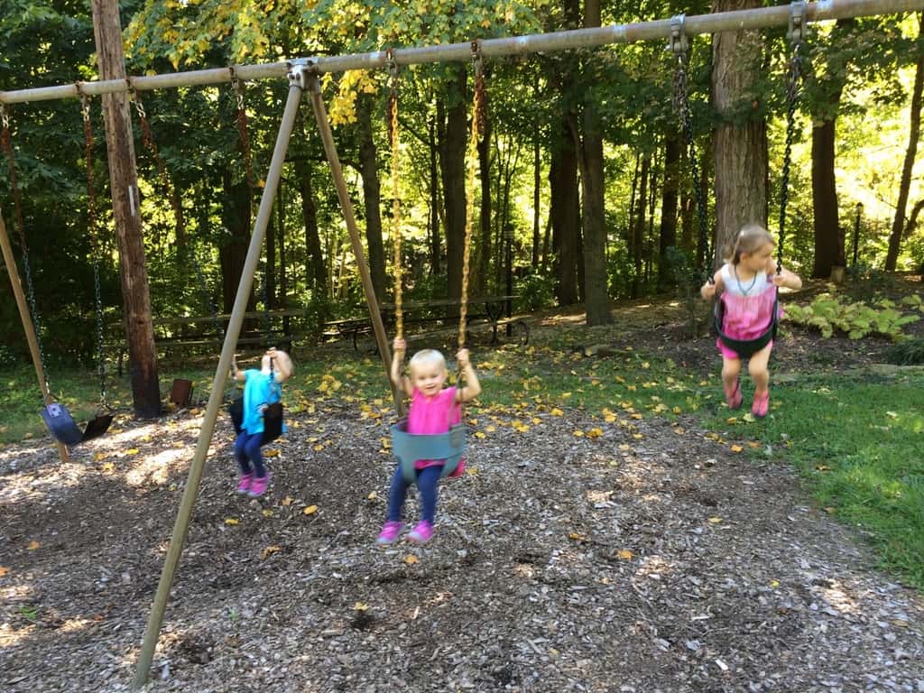 We’re loving our new house and neighborhood! The girls and I took a short walk this morning down to the Kenwood Hills Cabana Club to check out the pool and playground area. It’s a super short walk from our house, but feels miles away back in the woods. The girls greatly enjoyed swinging, playing on the play structure, and collecting landscaping pebbles from the picnic area. I can’t wait to take them swimming there next summer!