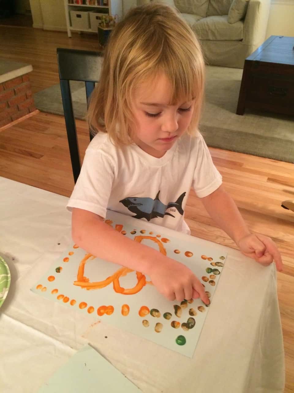 Three girls, three painting personalities… I brought out two pieces of paper for each girl. Josie was so busy mixing paint colors on her plate that she barely used one sheet. Gwen used one sheet too, but only because she was focused and determined to perfect her masterpiece. Abby, on the other hand, happily snatched up the spare paper. She needed to paint pictures for everyone!

Thirty plus minutes of painting was pretty good for little ones. If it had kept them occupied longer, I would have given them all the paper they wanted! 😉