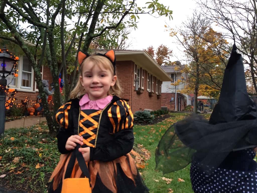 Trick-or-treating in our new neighborhood was awesome! There were tons of kids, lots of folks were outside passing out treats while enjoying a fire, and the fire department even brought a truck (with flashing lights) to pass out full-sized candy bars! The girls had a really good time. Gwen and Josie were too tuckered out after awhile, but they greatly enjoyed eating their goodies while we chased Abby around with their wagon.
