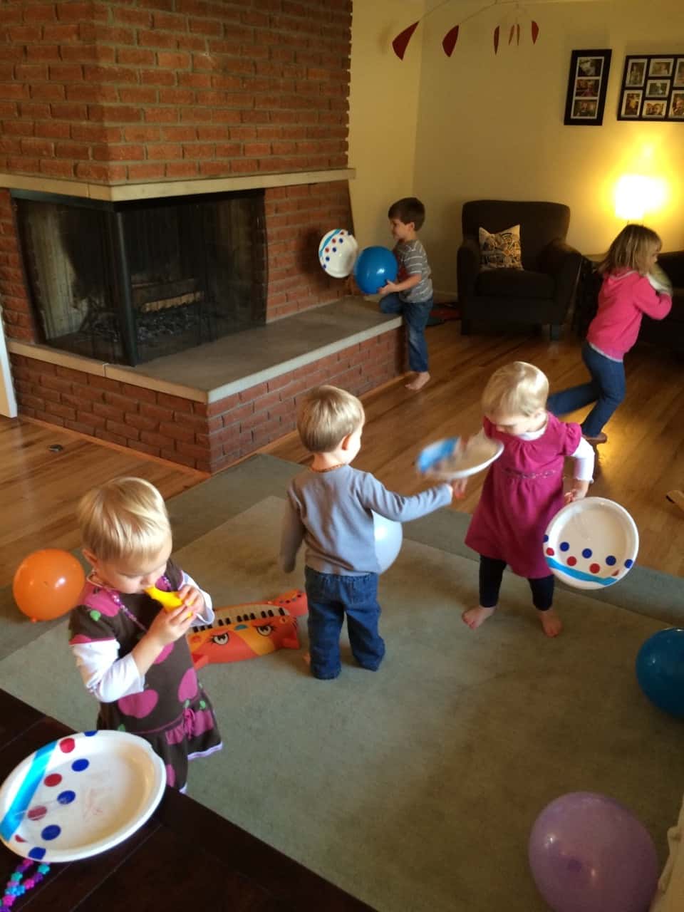 How does one entertain five little kids? By letting them design and then play with homemade “tennis rackets” and “balls.”