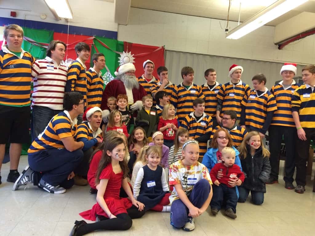 We all had a good time this morning at the Moeller Rugby Breakfast with Santa. Craft time with “Tickle Monster” Joey was especially popular. It took nearly two hours, but the girls eventually warmed up to the idea of visiting with Santa. Abby said she was going to test him to see if he was the real Santa by asking him if he had reindeer. He passed!