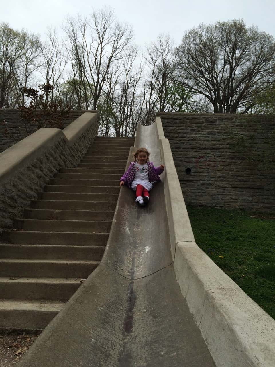 Mark this off the childhood must do list: riding the slide at Burnet Woods. Abby loved it!