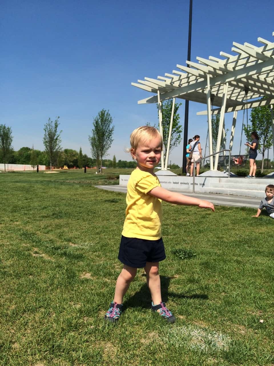 It felt like summer today! We got all hot and sweaty with a Madeira Moms playgroup at the new Blue Ash Summit Park. The girls enjoying playing on the awesome (albeit sun-drenched) play structure, swinging on the over-sized porch swings, and doing “tricks” on the great lawn. They capped off the fun by cooling off in their backyard pool. I hope they take great naps because all that sun and excitement sure wore me out!