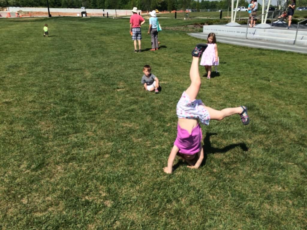 It felt like summer today! We got all hot and sweaty with a Madeira Moms playgroup at the new Blue Ash Summit Park. The girls enjoying playing on the awesome (albeit sun-drenched) play structure, swinging on the over-sized porch swings, and doing “tricks” on the great lawn. They capped off the fun by cooling off in their backyard pool. I hope they take great naps because all that sun and excitement sure wore me out!
