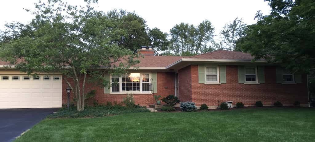 Tan and red no longer! We’re very pleased with our refurbished and repainted shutters. (We also removed the odd little window boxes.)