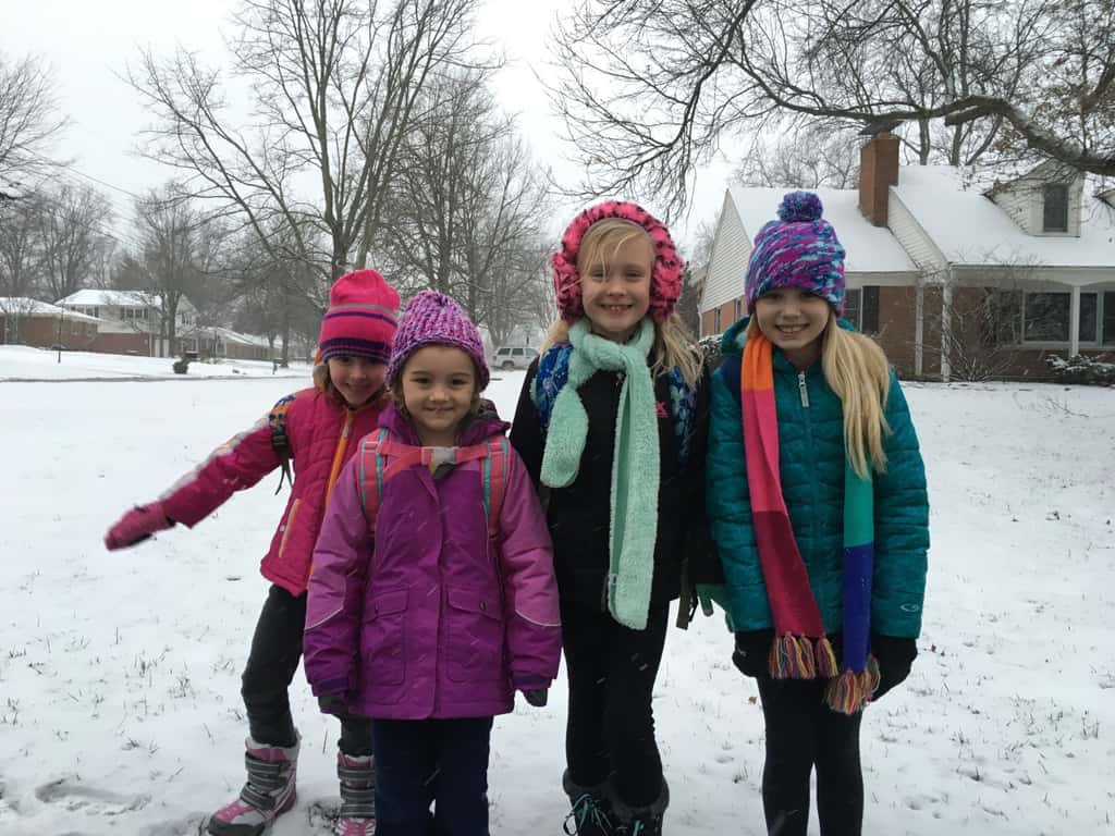 They may have preferred a day off school, but a snowy morning at the bus stop is fun too.