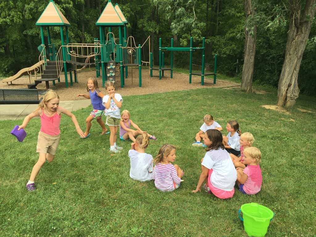 I planned a fun Girl Scout mini-camp for our troop today. We ate sun s'mores, made a photo craft, and played games like “sharks and lifeguards” and “drip drip drench.” (As I type this photo description, I’m wondering how Abby has enough energy to be jumping on the trampoline. I’m wiped out!)