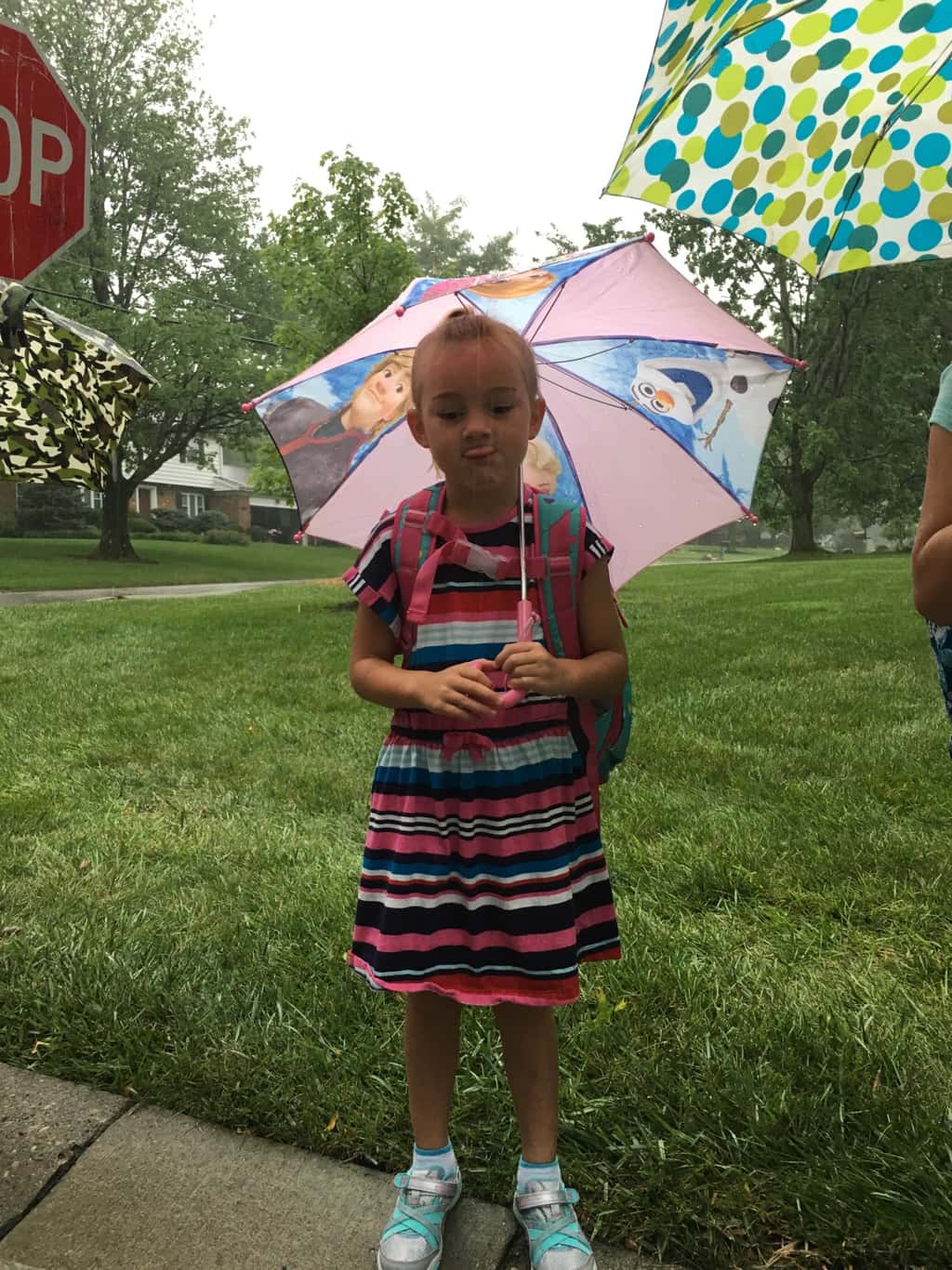 First day of first grade! Even the pouring rain couldn’t put a damper on the excitement at the bus stop this morning.