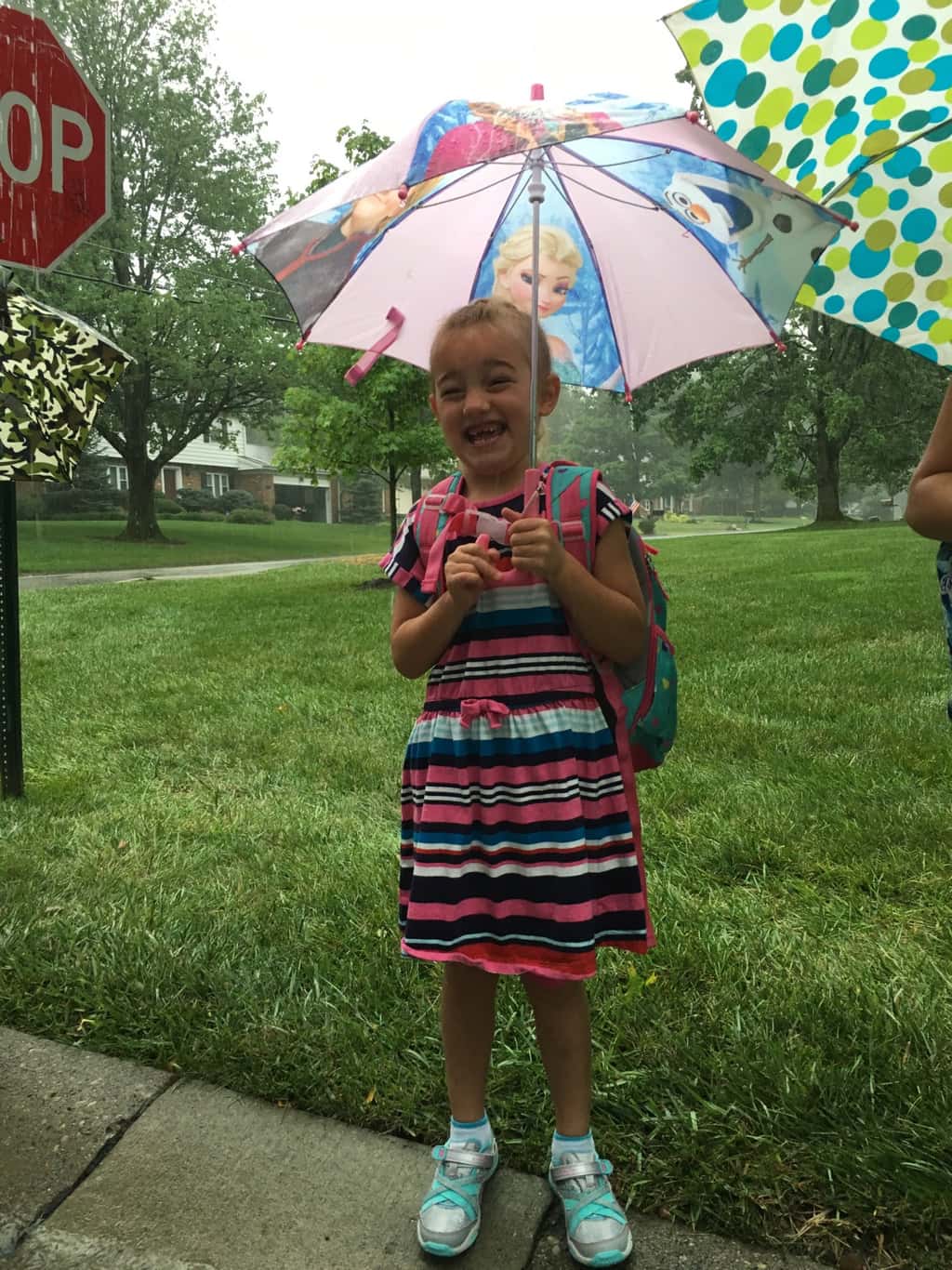 First day of first grade! Even the pouring rain couldn’t put a damper on the excitement at the bus stop this morning.