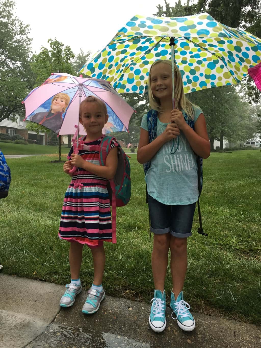 First day of first grade! Even the pouring rain couldn’t put a damper on the excitement at the bus stop this morning.