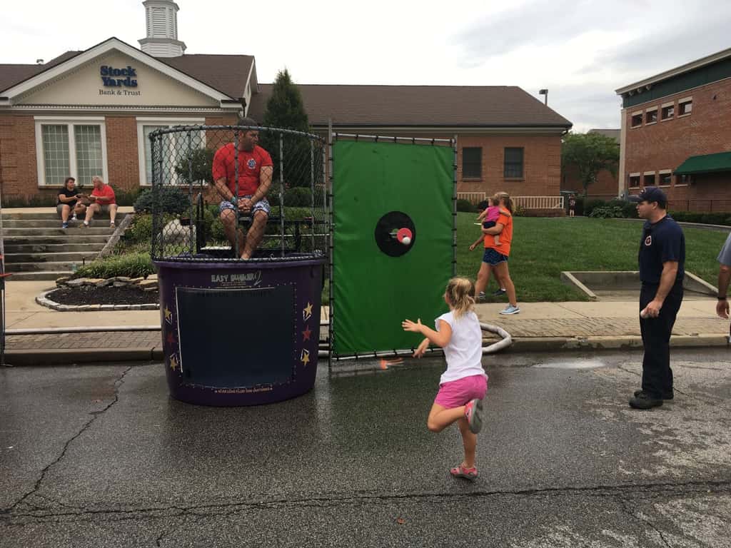 These girls finally got to dunk a firefighter at the Madeira Street Dance! Perhaps their throwing wasn’t quite powerful enough, but their hands sure could push in that target!
