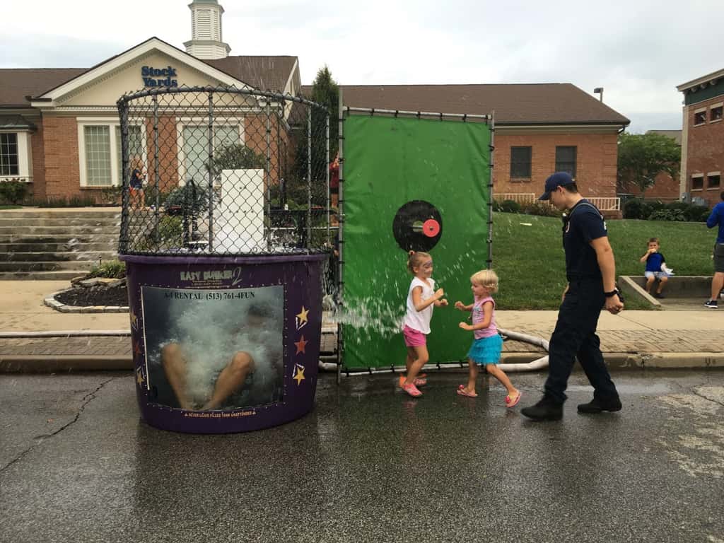 These girls finally got to dunk a firefighter at the Madeira Street Dance! Perhaps their throwing wasn’t quite powerful enough, but their hands sure could push in that target!