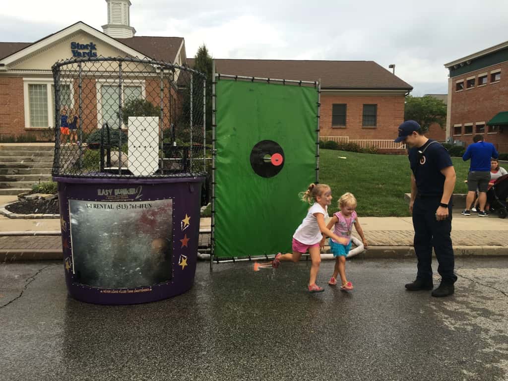 These girls finally got to dunk a firefighter at the Madeira Street Dance! Perhaps their throwing wasn’t quite powerful enough, but their hands sure could push in that target!