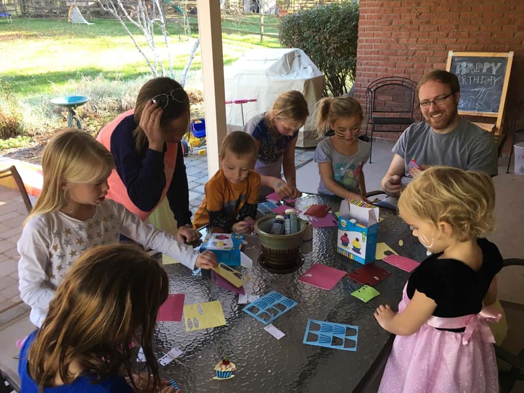 Take lots of bouncing friends, brush on some face paint, press on some tattoos, mix in a craft, eat lots of cupcakes and ice cream, and you end up with two very happy birthday girls!
