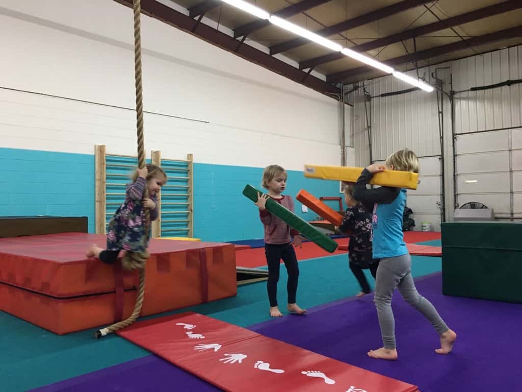 The girls love that our preschool playgroup keeps meeting at Gym Skills.