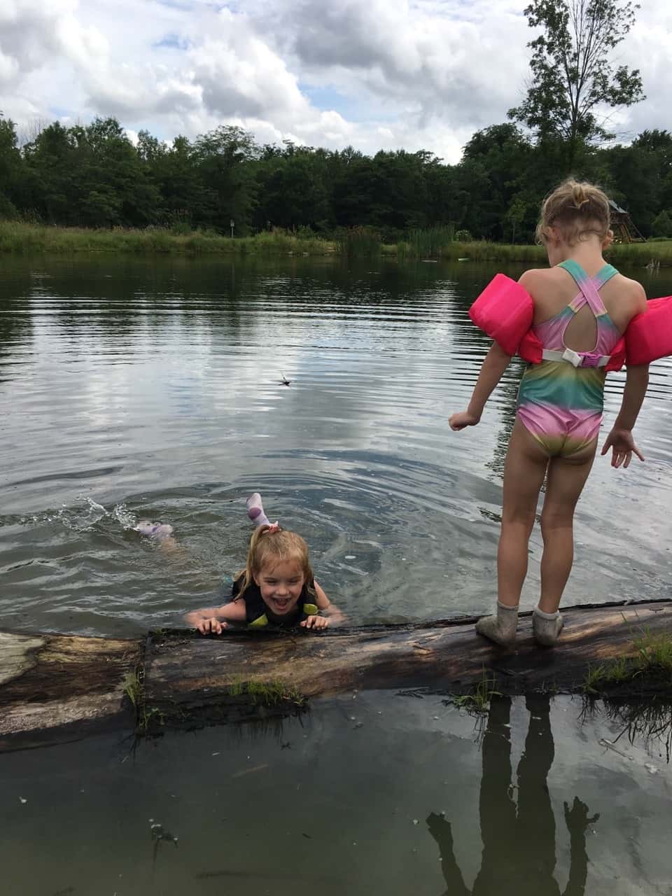 The girls swam in water other than a swimming pool for the first time today at Stella and Ruby’s house, and they loved it! Gwen was unsure of the muddy bottom, but she did finally jump in with everyone else. Josie freaked out when the dogs or goats got too close, but didn’t blink an eye at swimming with frogs and turtles. Abby is part farm girl. She loved everything!