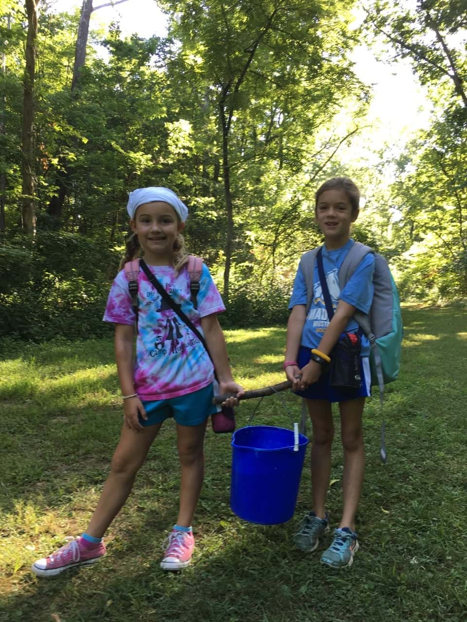 Girl Scout camp day 3 started off with our girls leading the rest of camp in the opening flag ceremony. After that, the day flew by with a talk about graphic design, cards for a service project, a nature scavenger hunt, sun s'mores, a group skit, a spider web craft, singing, creek time, hiking, and more!