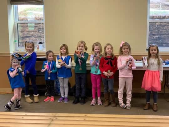 Josie’s sparkly birthday cake racer came in first place in our Daisy race of the 2019 Madeira Scouts Pinewood Derby! Abby’s Ravenclaw racer and Gwen’s rocket were both cool cars, but not quite fast enough to win (6th place).