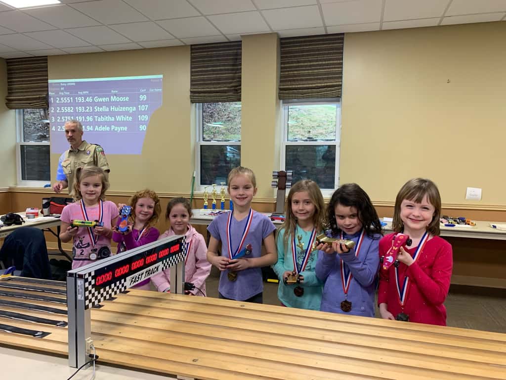 Gwen’s car won first place, and Josie’s car won the “most creative” design medal for their troop. Abby’s car won “most original design” for her troop. And Gwen’s car came in second place in the best of Madeira race for this year’s Madeira Pinewood Derby!