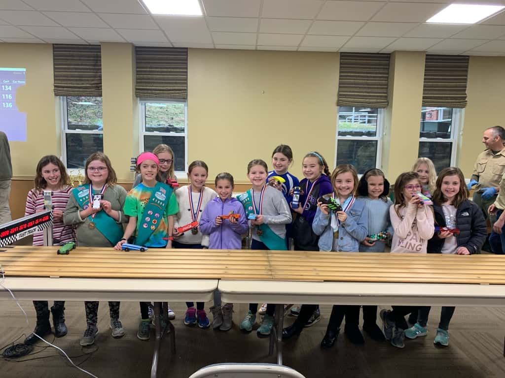 Gwen’s car won first place, and Josie’s car won the “most creative” design medal for their troop. Abby’s car won “most original design” for her troop. And Gwen’s car came in second place in the best of Madeira race for this year’s Madeira Pinewood Derby!